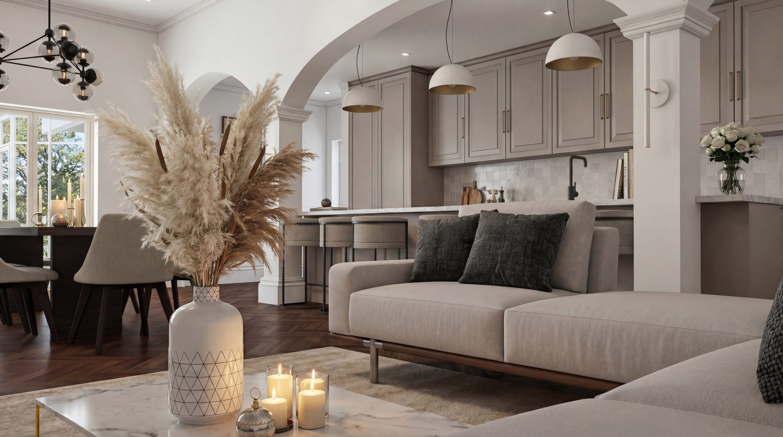 Modern open-concept living space with neutral tones, arched doorways, herringbone floors, and elegant kitchen cabinetry