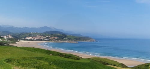Panorama of beach and green Cantabrian coastline