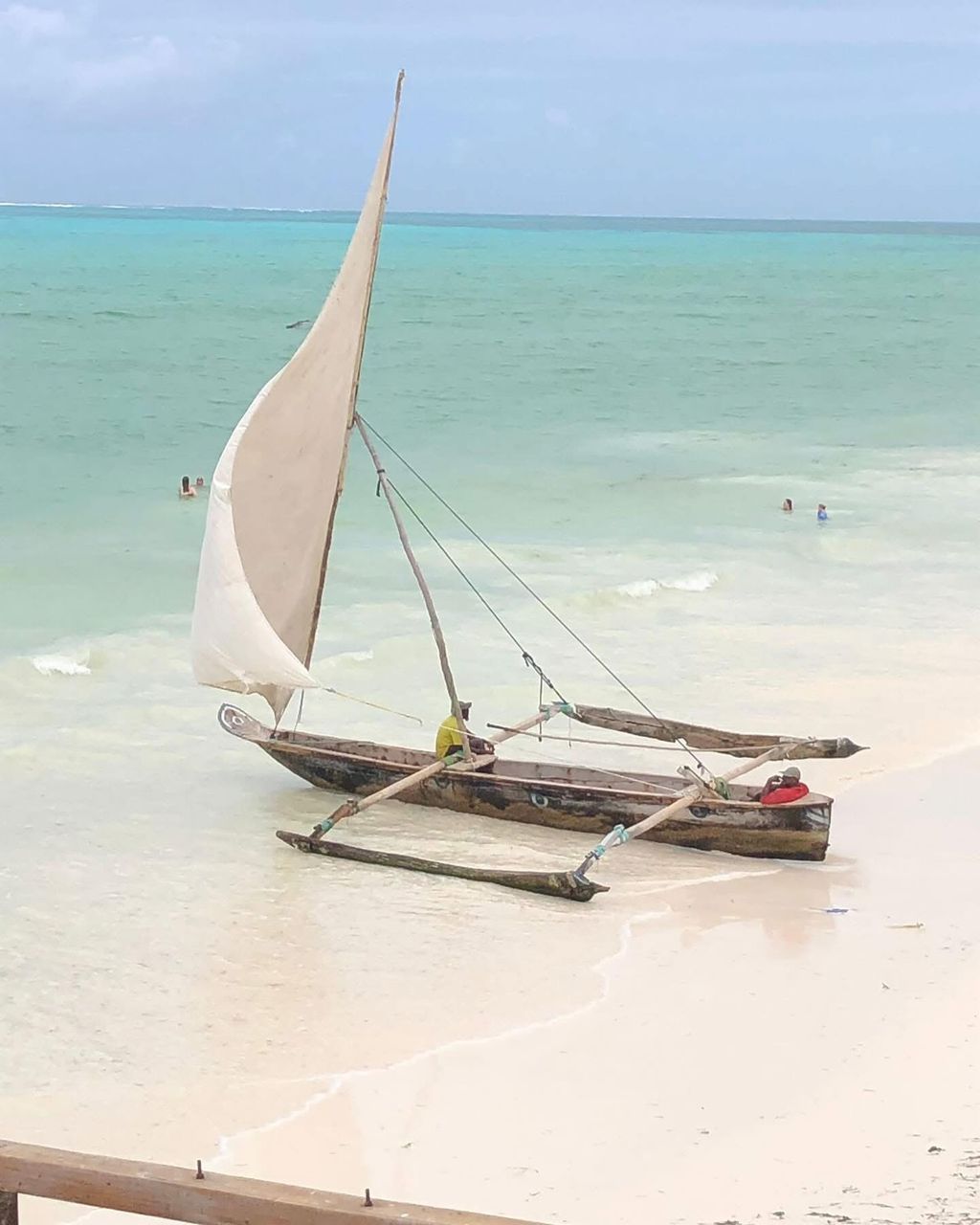 Aerial view of Zanzibar coastline with turquoise Indian Ocean water and white sand beach, Tanzania beach extension after safari