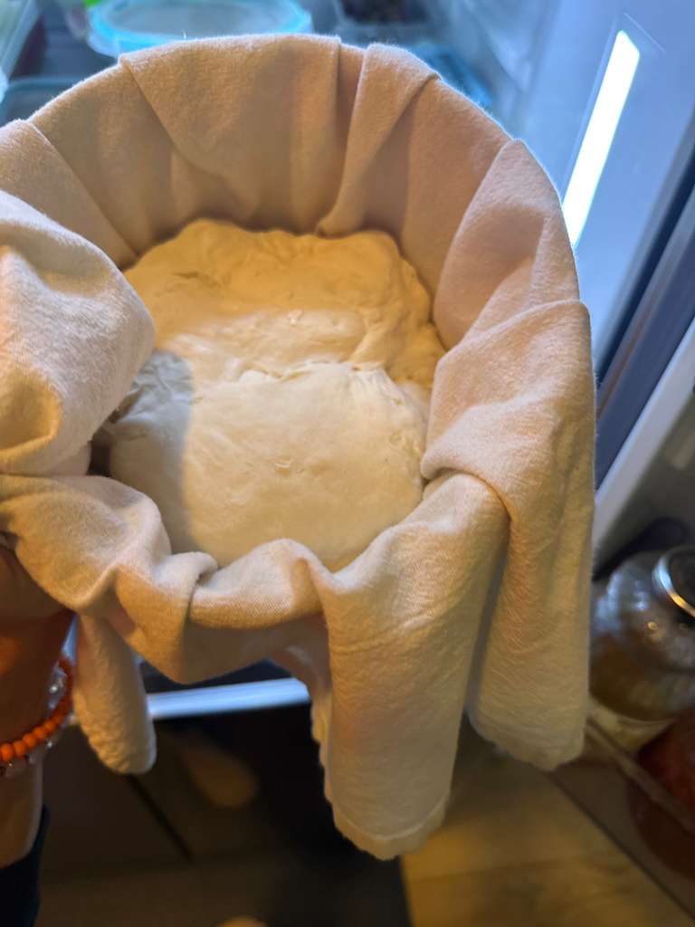 Shaping sourdough dough into a round boule