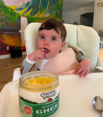 Baby exploring real whole foods at mealtime
