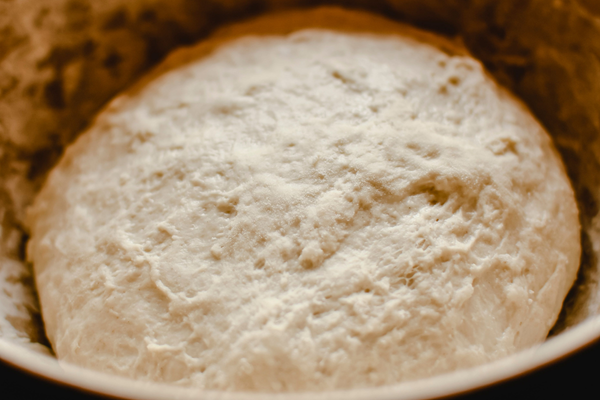 Sourdough discard pretzel dough after rising until doubled in size.