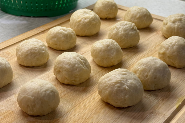 Divided portions of sourdough discard pretzel dough ready to shape into pretzel bites.