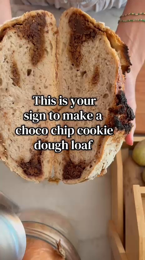 Sliced chocolate chip cookie dough loaf showing swirls of cookie dough and chocolate throughout the bread.