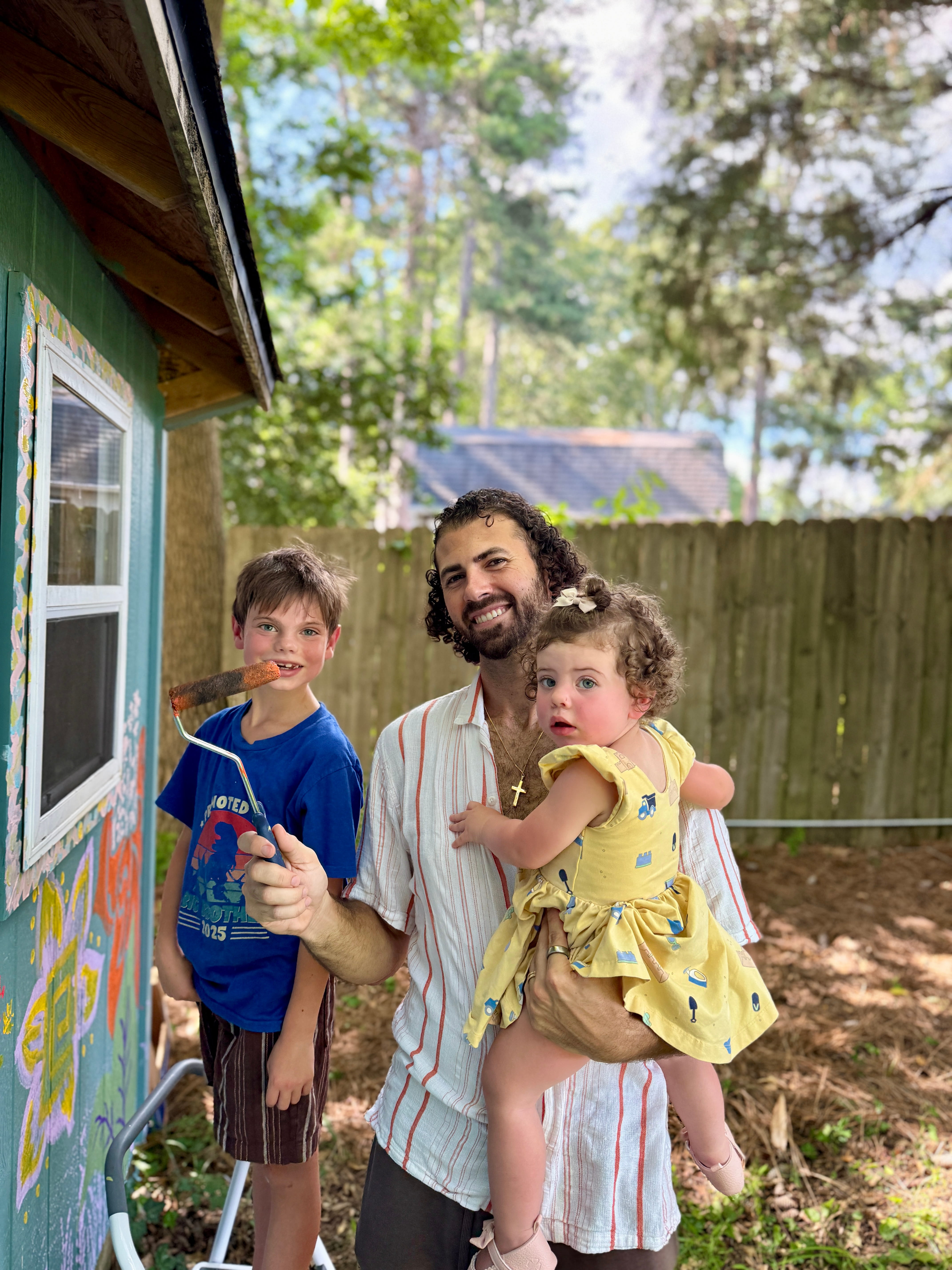 Family standing together at home, representing the heart behind a calmer school week routine.