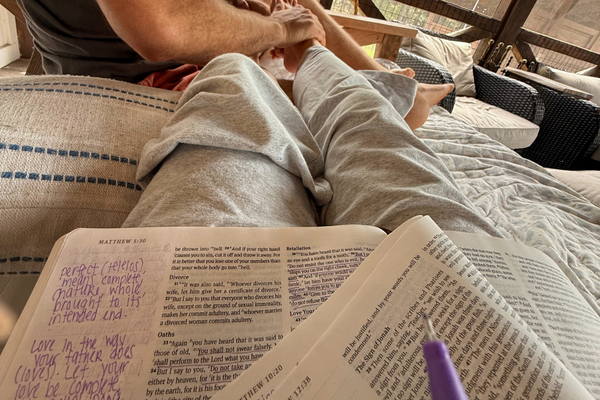 Open Bible and handwritten notes during a quiet moment of reflection and prayer.
