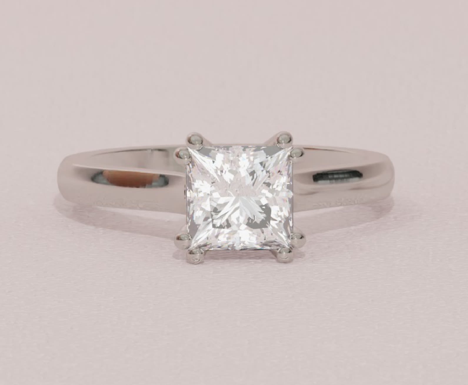 Princess cut solitaire with a white gold band.jpg