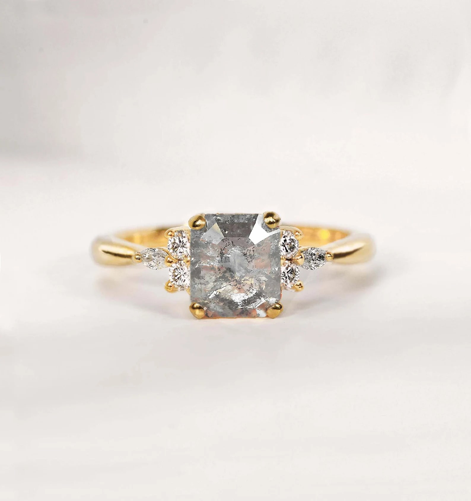 Emerald cut salt and pepper diamond in yellow gold