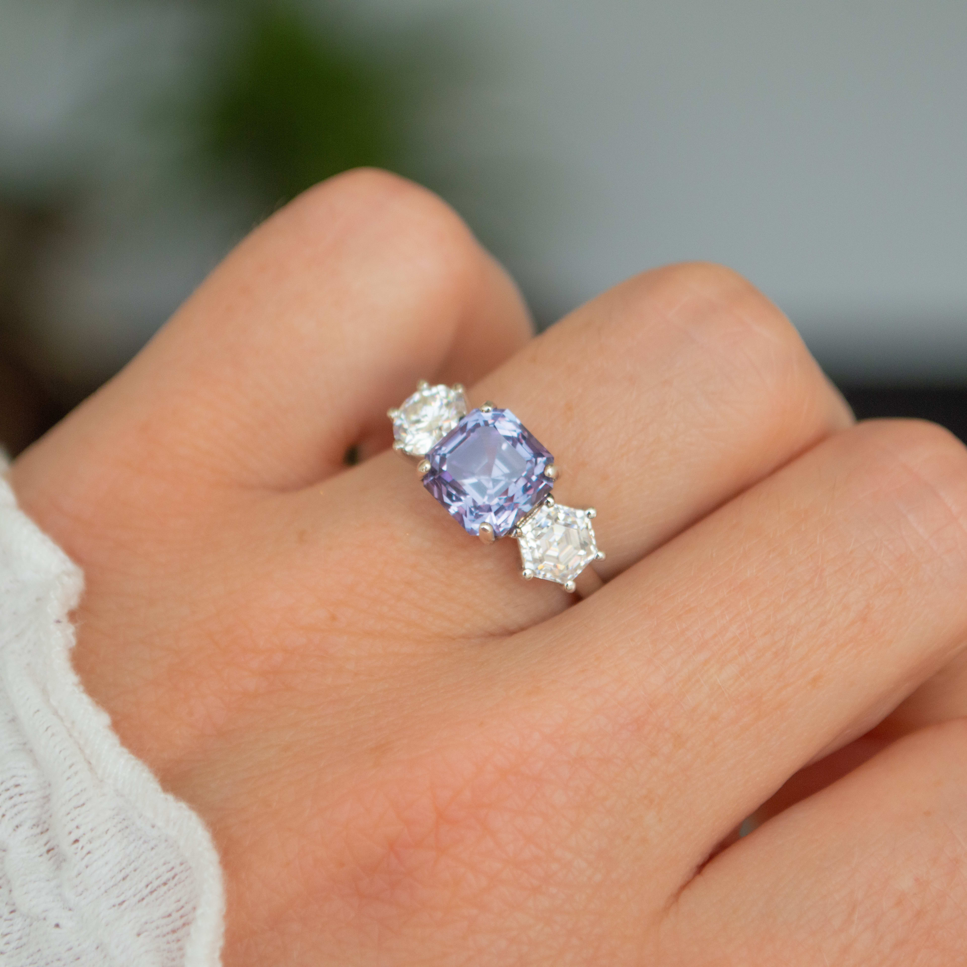 1.5 carat equivalent Cushion cut translucent lilac-blue sapphire with 1 carat accenting hexagonal cut lab grown diamonds