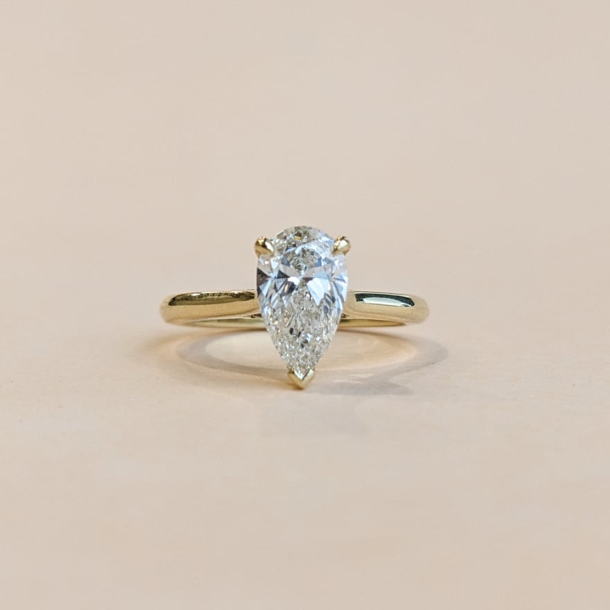 Pear solitaire with gold band.jpg