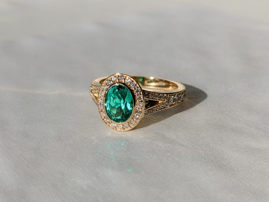 Oval Emerald with halo.jpg