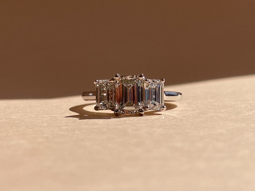 3 stone Emerald diamond engagement ring.jpg