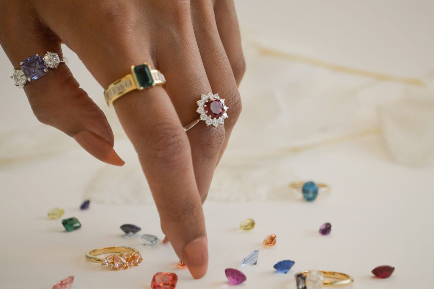 A collection of Four Words Gemstone Rings and Loose Sapphires