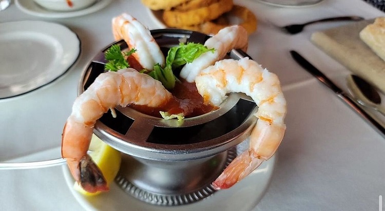 Ocean Grill serving food on white tablecloths with a spectacular beach atmosphere