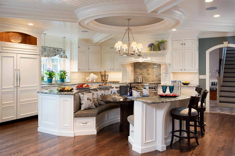 The kitchens with Island should definitely provide a seating solution. I am stunned by the ceiling work as well. love the kitchen Island bar-chairs