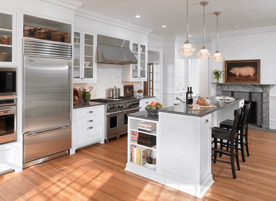 2 level Kitchen Island design with white cabinetry toped by dark gray or black granite top
