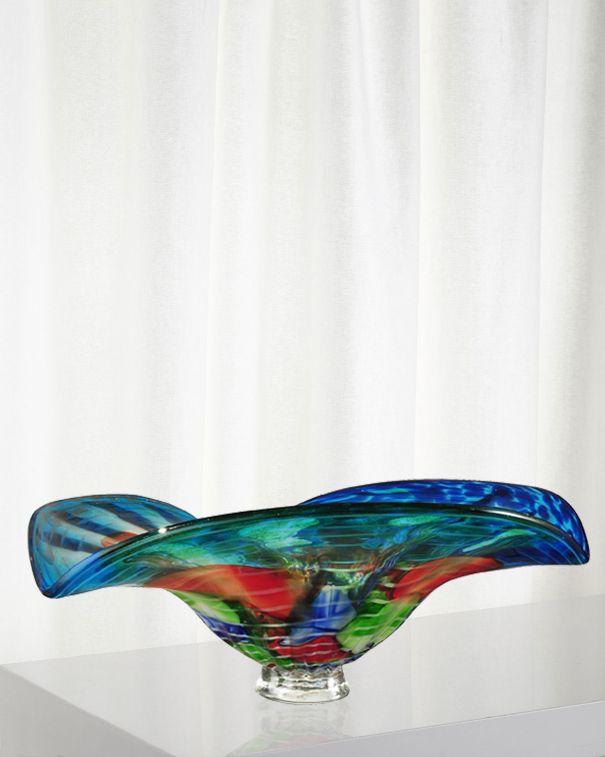 9 Must Have Home Accessories For A Cozy Home Decor suggestion Our Newport Heights bowl will add a splash of colorful drama to any décor style. This lovely bowl features a background of dark blue and green at the bottom, which gradually lightens to vivid sky blue at the top. • Handcrafted bowl.
• Made of art glass.
• Approx. 15.3"W x 13"D x 6.5"T.
• Wipe clean with dry cloth.
• Imported.