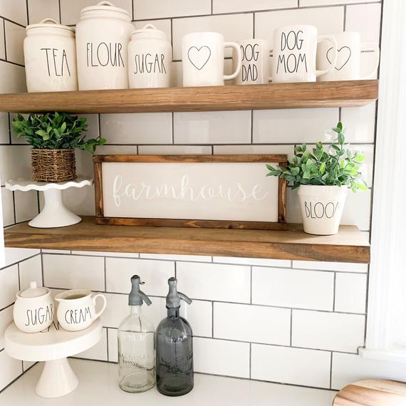 The Ultimate Farmhouse Guide - Farmhouse 20202 Decor -
Farmhouse decor Kitchen Counter....Floating shelf in contrast to white subway back splash
Discover:
Wall Signs & Decals
Massive Wall Shelving
Fine Farmhouse Wall Art
Farmhouse Wall Clock
Rustic Farmhouse Lighting'
Farmhouse Rugs