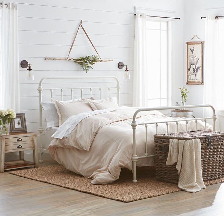 A iron bed frame coupled with some oil rubbed bronze sconces will offer simply the