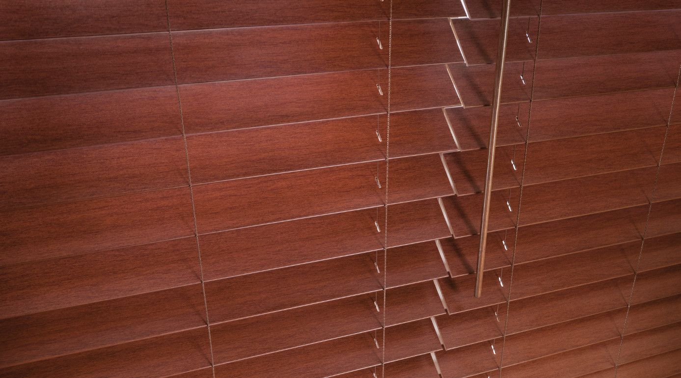 Faux Wood Window Blinds are PVC Blinds that are made from a solid or foamed Poly Vinyl Chloride (PVC) plastic. PVC blinds have really gain popularity over the past 20 years. They are usually 2" to 3 Inches wide. And the blind louvers surface is smooth. However, they are also available in a very luxurious and classy looking wood grain imitation.
