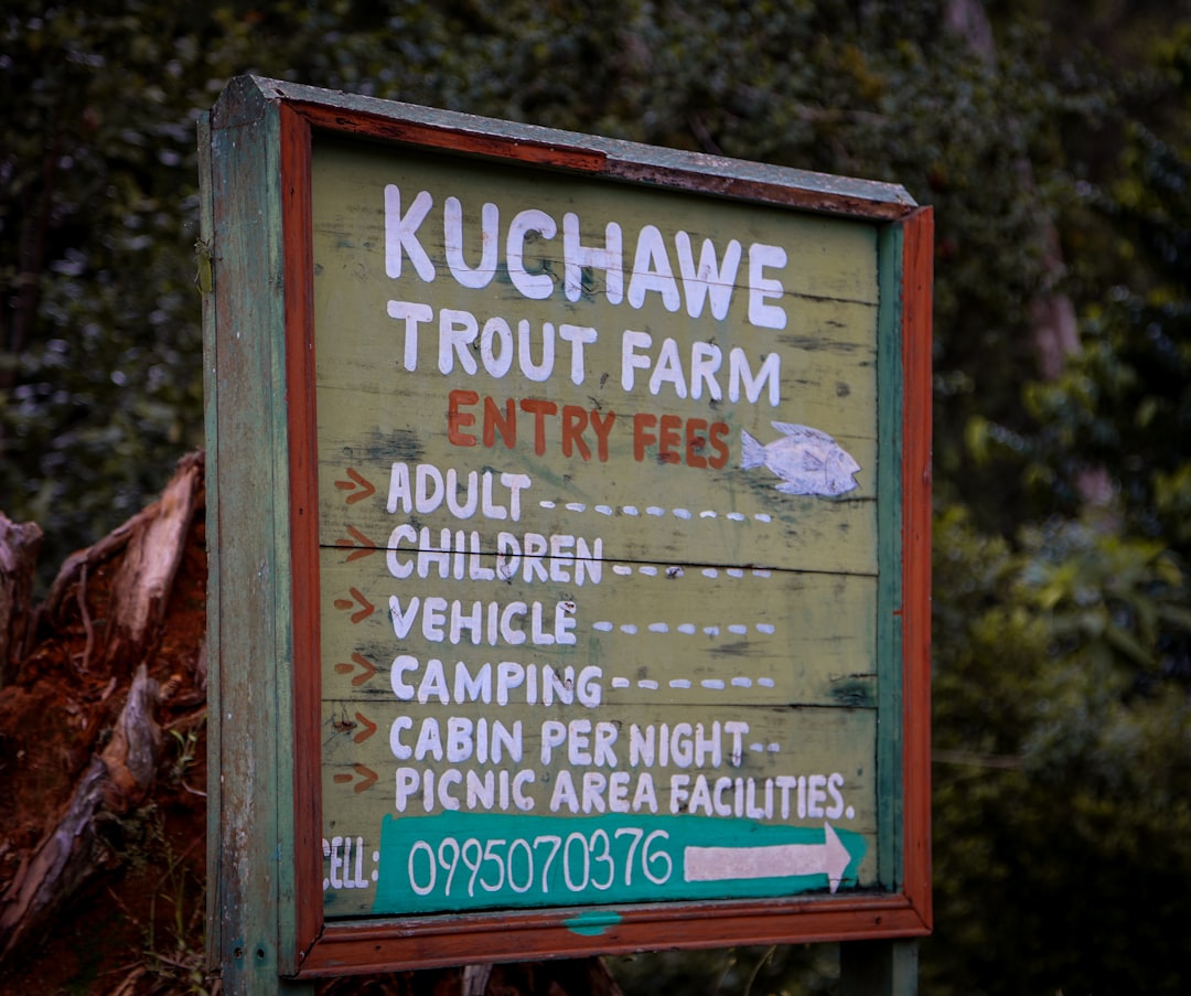 Sign for kuchawe trout farm with entry fees listed