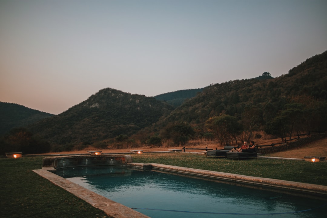 a swimming pool in the middle of a field