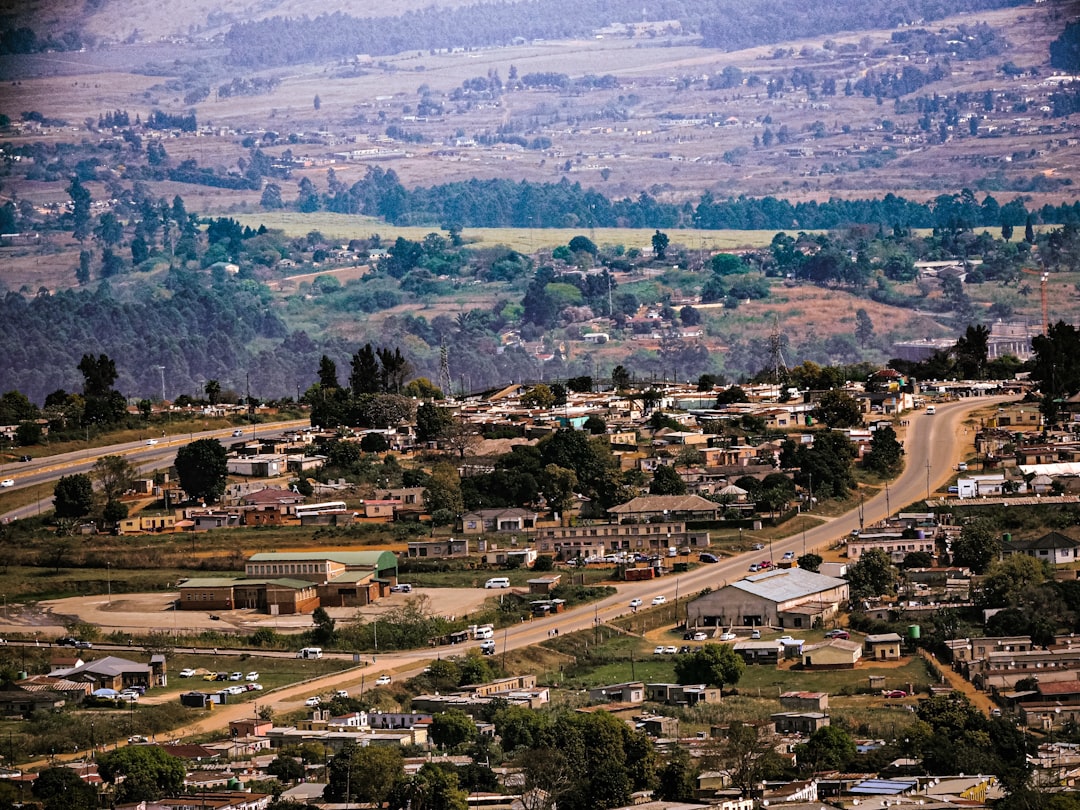 A sprawling township with winding roads and distant hills.