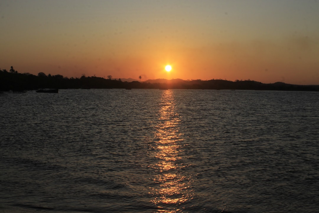 a sunset over a body of water