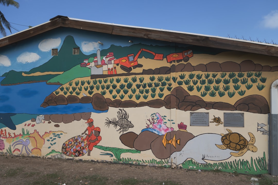Mural depicting landscape, industry, and marine life
