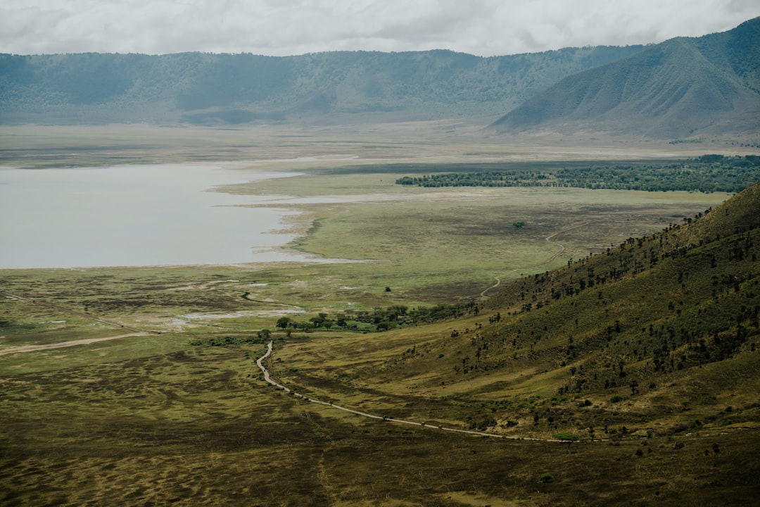 Vast landscape with lake and mountains visible