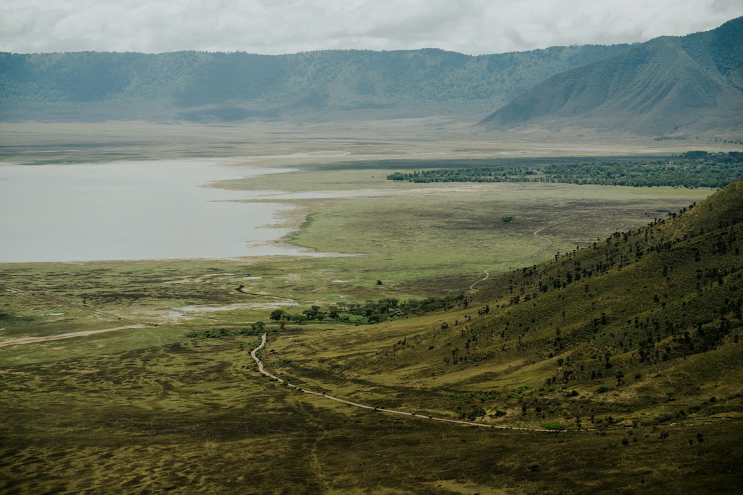 Vast landscape with lake and mountains visible