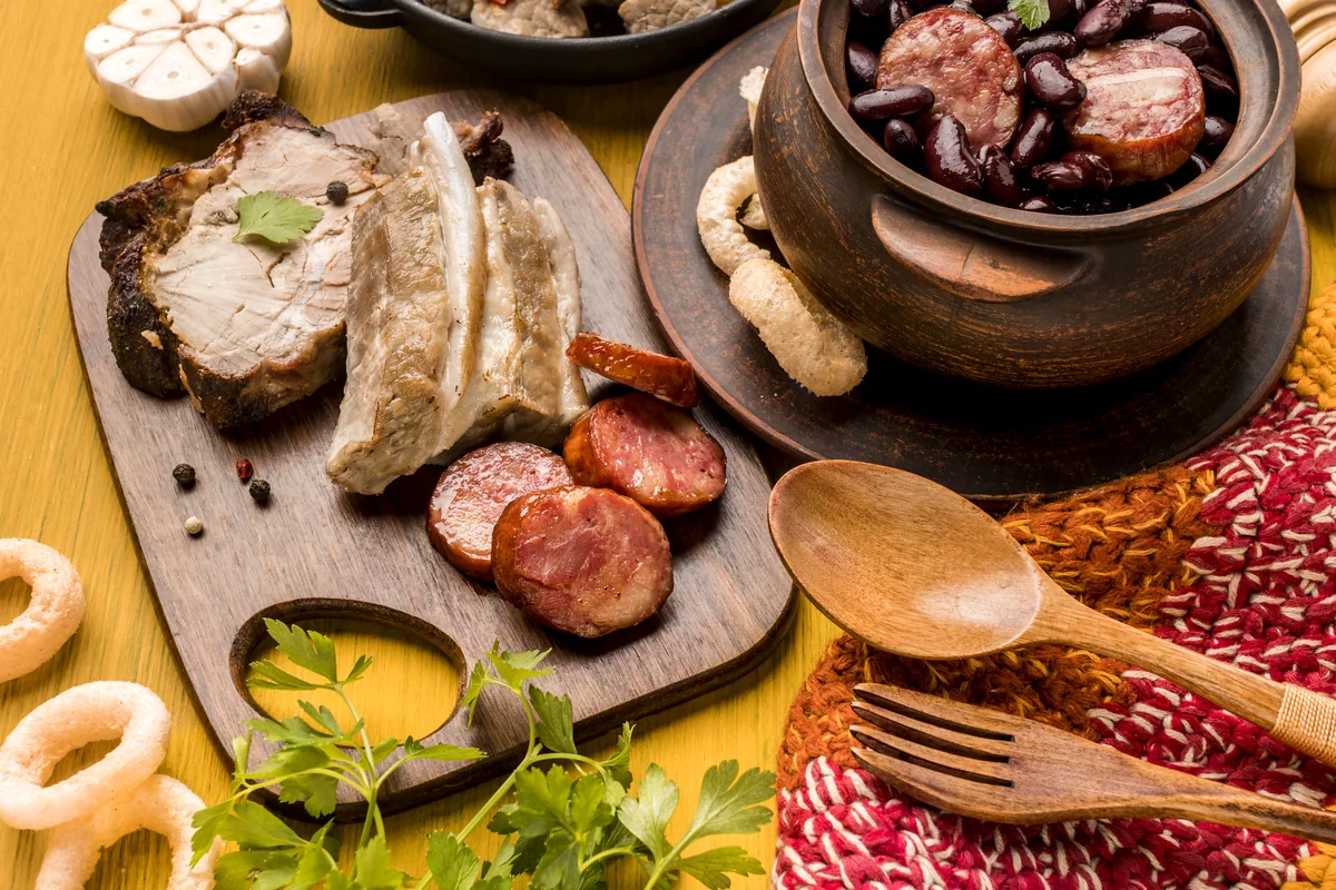 lechona tolimense traditional Colombian pork dish rustic wooden table