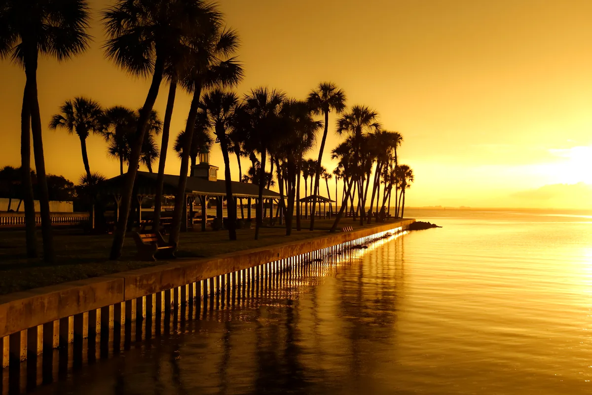 Coveñas Colombia beachfront hotel cabins palm trees Caribbean coast sunset