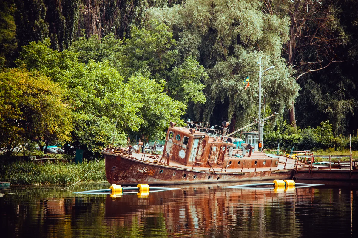 Leticia Amazonas Colombia river port wooden boats jungle background