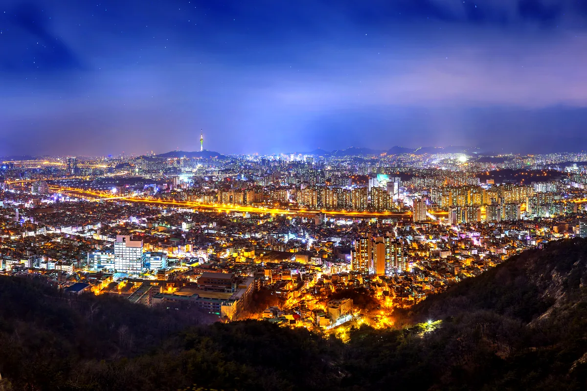 Medellin city skyline night El Poblado Colombia aerial view