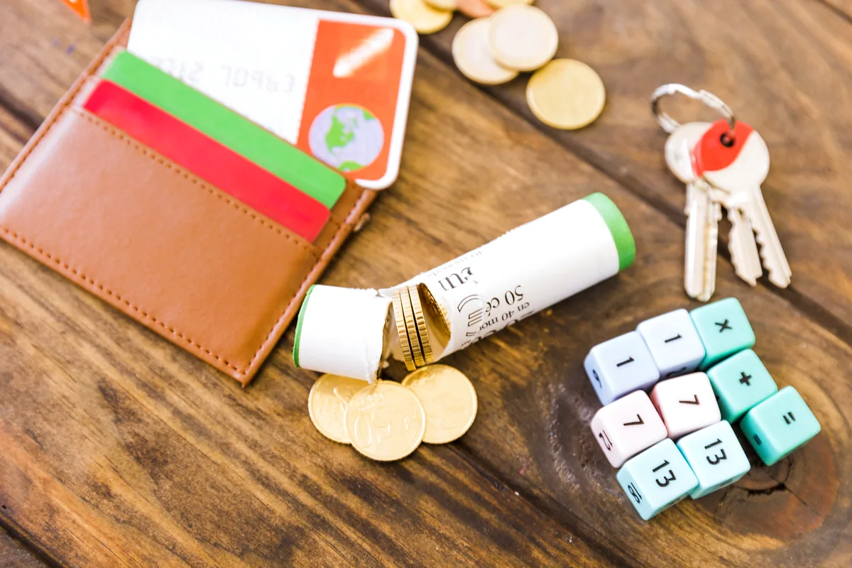Mexican peso banknotes coins wooden table travel accessories