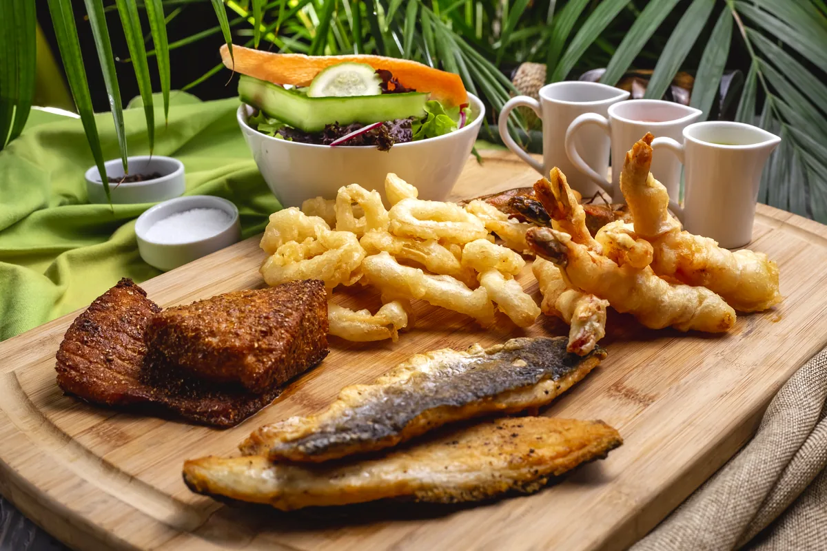Colombian Caribbean coastal seafood fried fish coconut rice patacones restaurant table