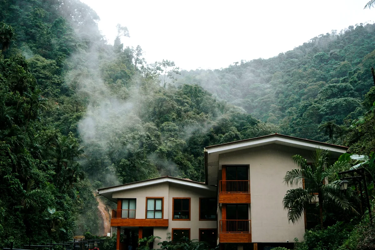 Eco lodge wooden cabin surrounded by Amazon rainforest Colombia