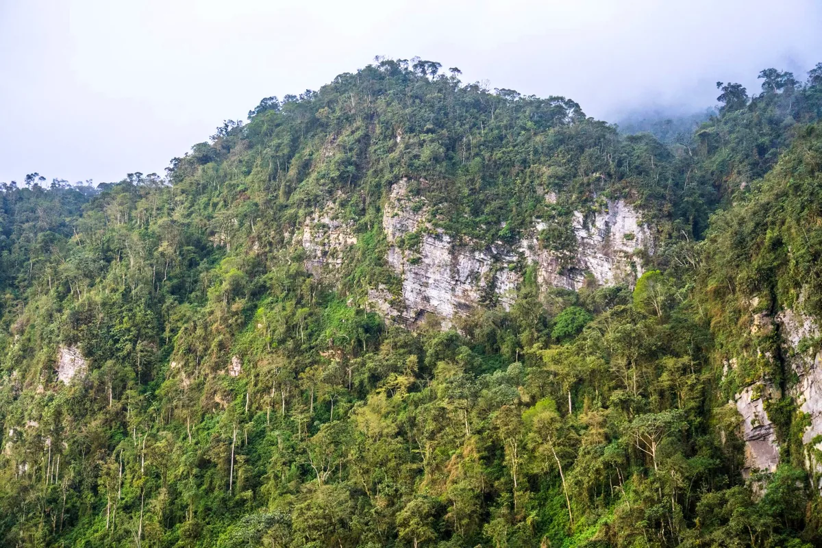 San Gil Colombia natural cave entrance zipline cable crystal clear river jungle