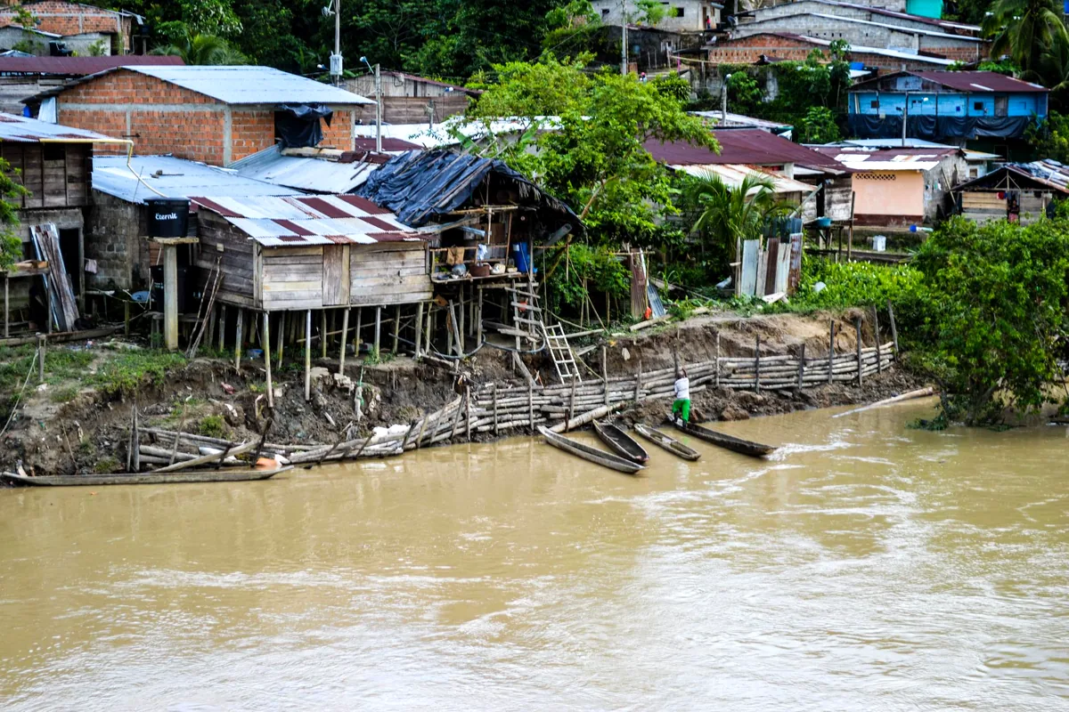wooden dugout canoe Atrato river Choco Colombia dense rainforest