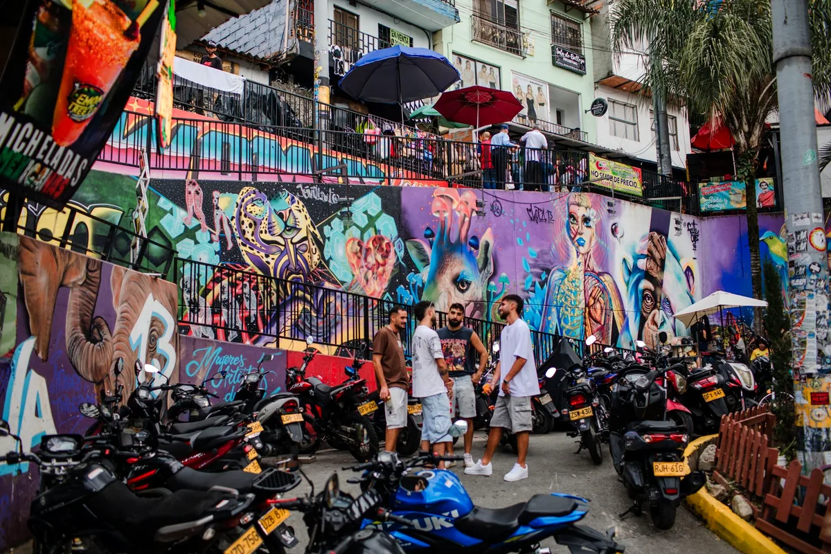 Medellin El Poblado neighborhood colorful streets boutique cafe Colombia