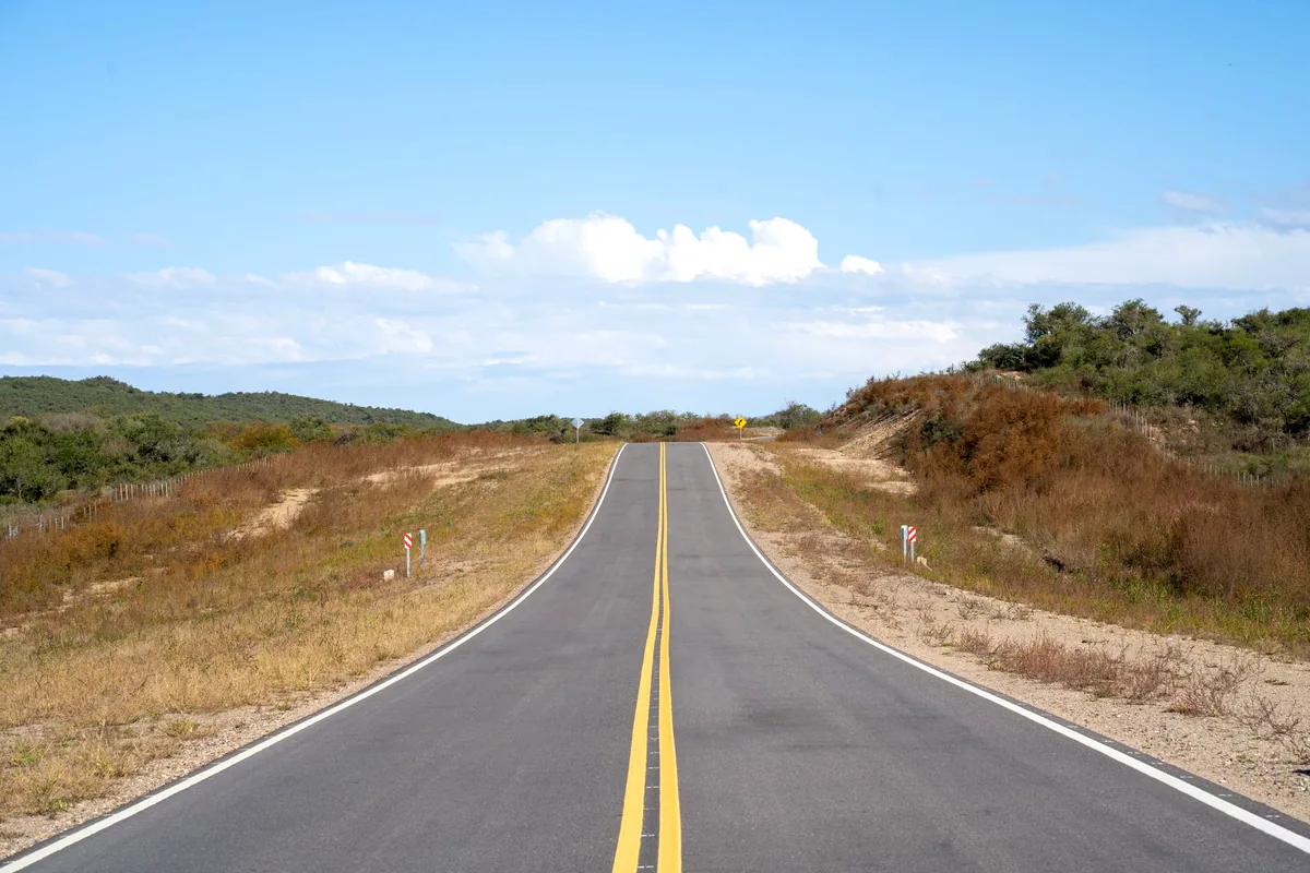 Mesetas Meta Colombia paved road green hills llano landscape