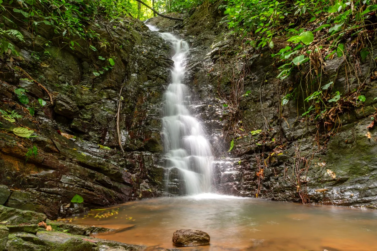 Arenales waterfall Sierra La Macarena Colombia white sand beach jungle cascade