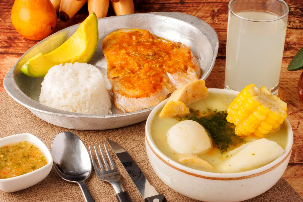 Traditional Afro-Colombian Pacific cuisine seafood encocado rice coconut wooden table Buenaventura Colombia