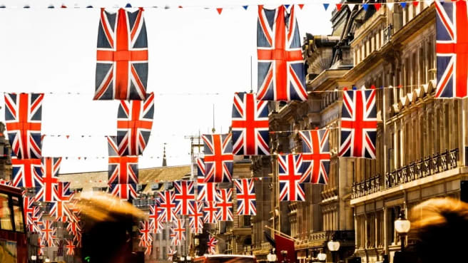 A British street with many British flags.