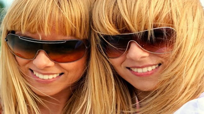 Two blonde twin sisters with matched sunglasses (Look Like Celebrities).
