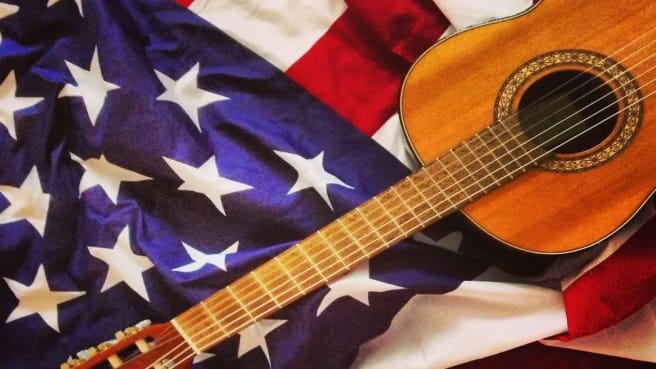 Country Music guitar on an American flag.