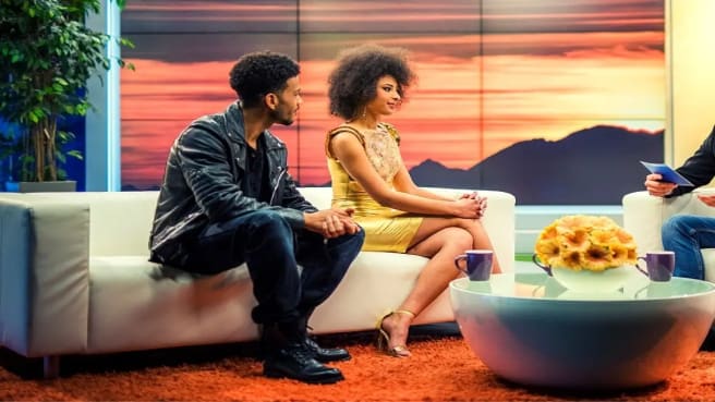 A Famous Couple of two celebrities is interviewing in a TV show.
