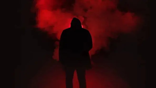 A scary scene from Typical of Horror movies of a shadow man stands in a smoke.