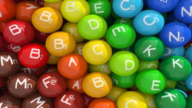 Nutrients and vitamins names on a colorful background.